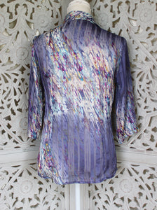 Purple Blouse with White Floral Pattern